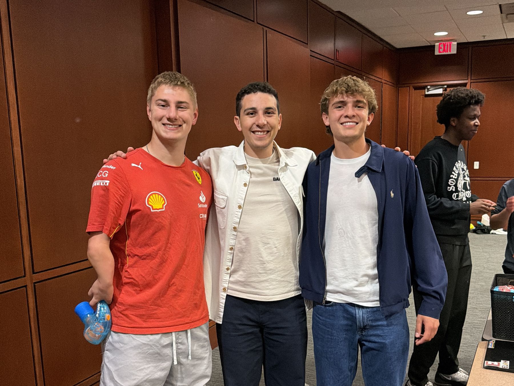 Three friends at an event on campus
