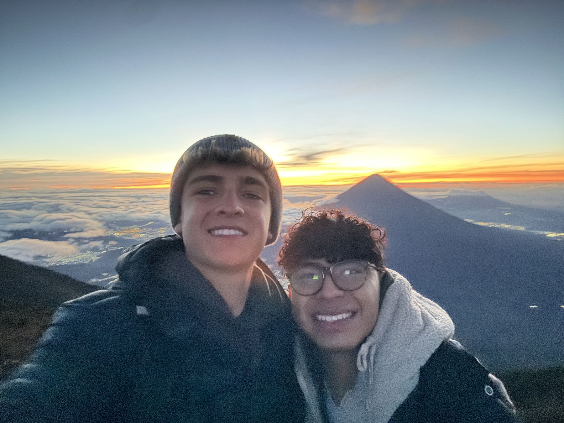 Sunrise above the clouds on Acatenango with a friend