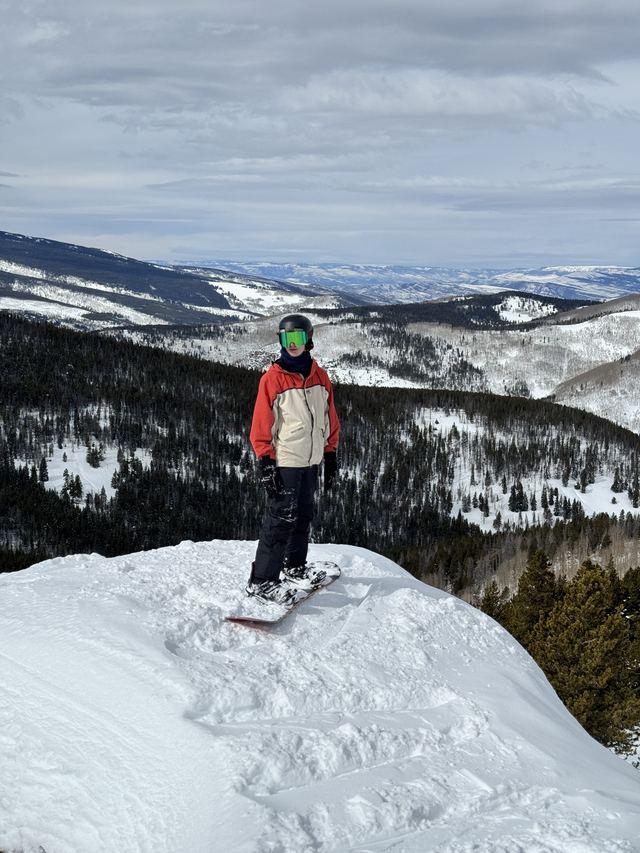 Snowboarding above the valley at Vail