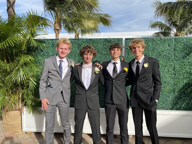 Tyler and friends in suits before a formal