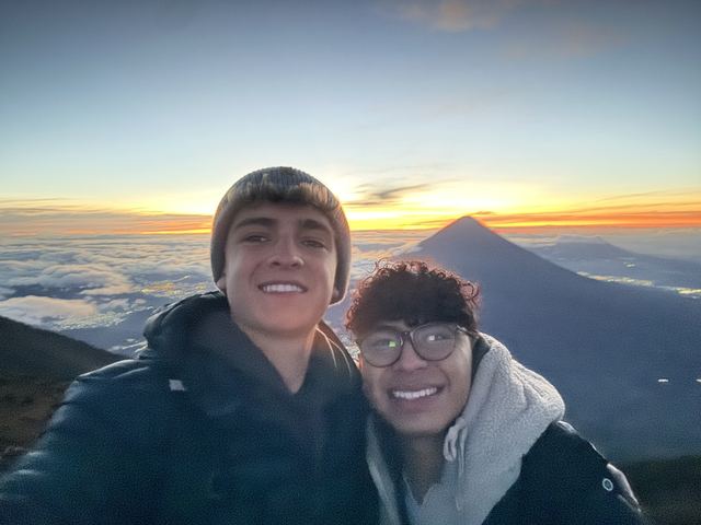Sunrise above the clouds on Acatenango with a friend